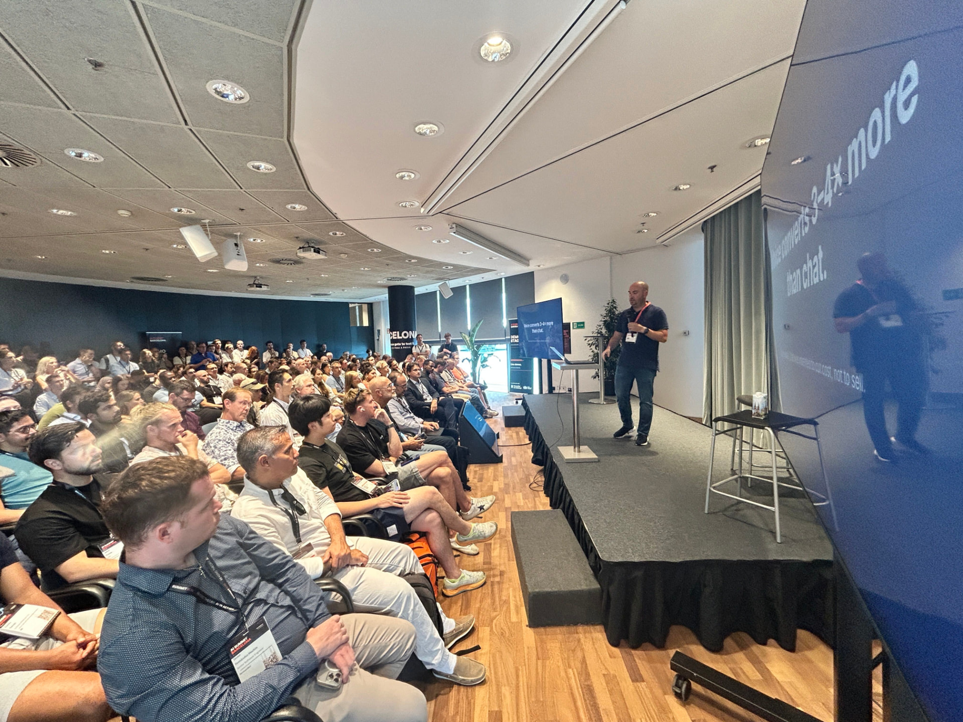 Alex Bisbe, CEO of VoiceB, presenting on the Demo Stage at AI Summit Barcelona 2026 in front of a full room